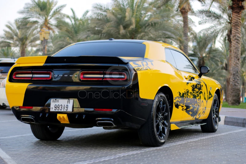 Yellow Dodge Challenger V6 2018 for rent in Dubai 8